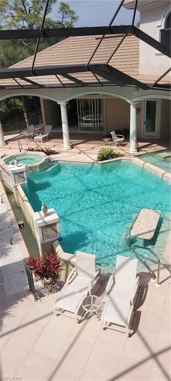 1269 Pocantico Lane Naples, FL 34110 - Photo 38 of 45 a front view of house with yard and outdoor seating