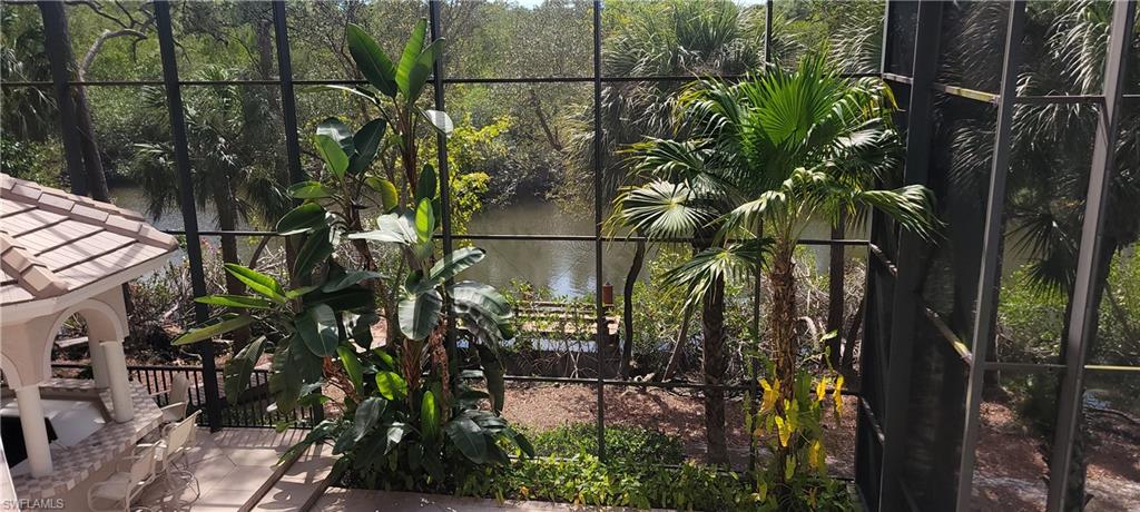1269 Pocantico Lane Naples, FL 34110 - Photo 40 of 45 a backyard of a house with lots of green space