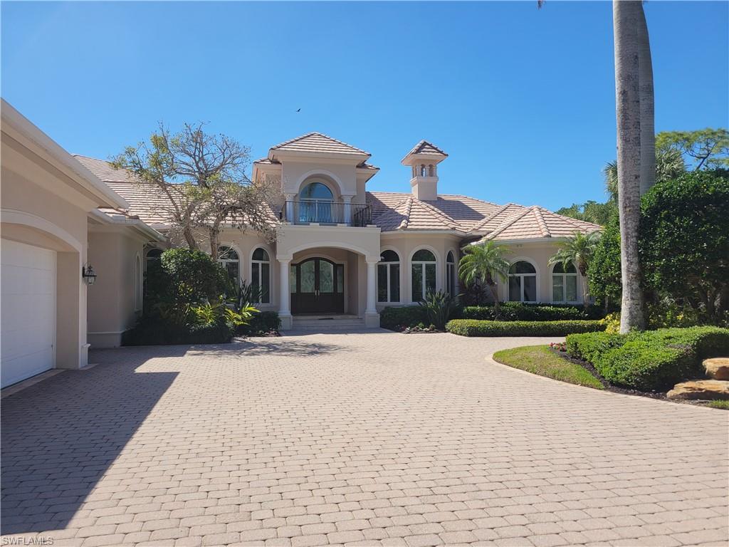 1269 Pocantico Lane Naples, FL 34110 - Photo 44 of 45 a front view of a house with a yard