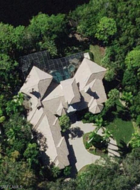 1269 Pocantico Lane Naples, FL 34110 - Photo 45 of 45 an aerial view of a house with lots of trees