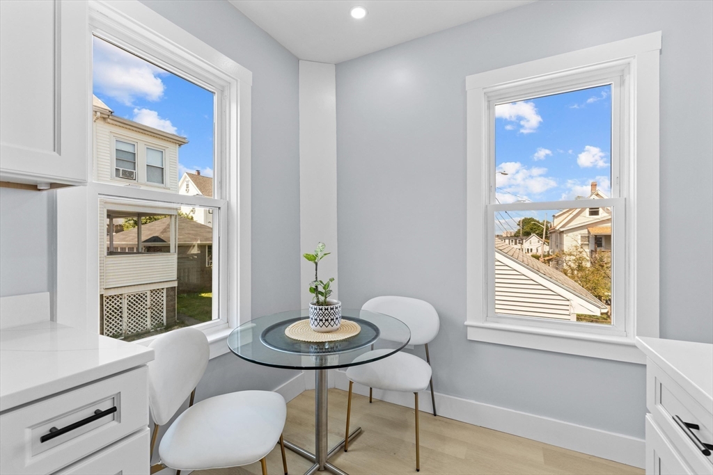15 Bennett Street Everett, MA 02149 - Photo 23 of 39 a view of a dining room with furniture window and wooden floor