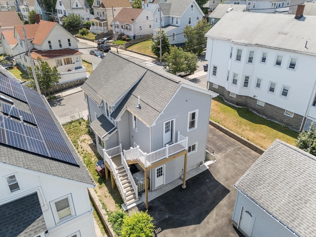 15 Bennett Street Everett, MA 02149 - Photo 35 of 39 an aerial view of residential houses with outdoor space