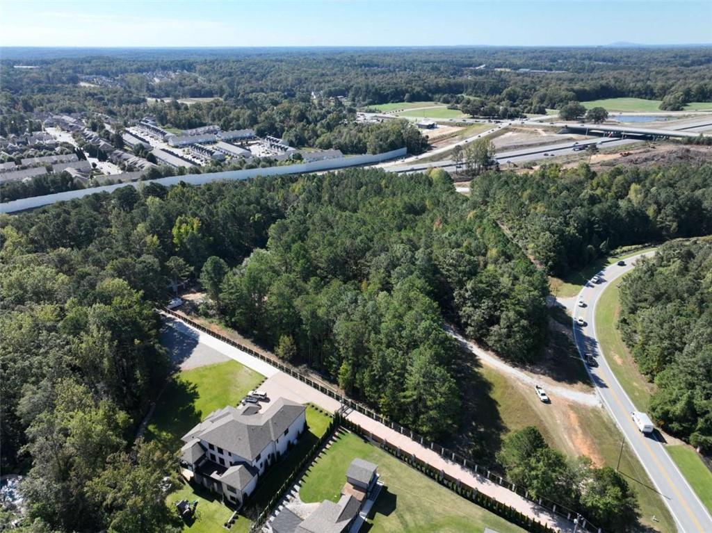 2655 Camp Branch Road Buford, GA 30519 - Photo 6 of 21 an aerial view of house with yard and mountain view in back