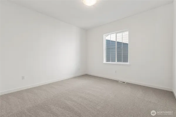 a bathroom with a double vanity sink a mirror and a bathtub