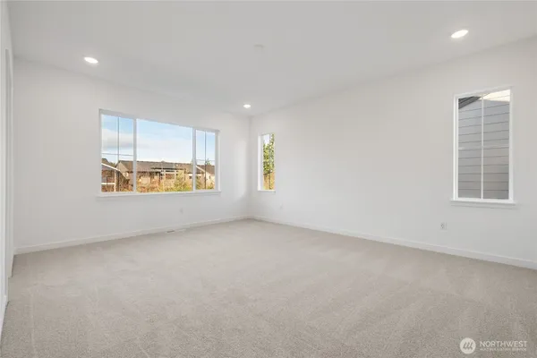 a view of a swimming pool with a garden and trees