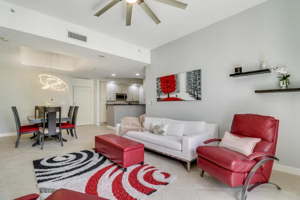 a living room with furniture and a rug