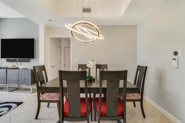 a view of a dining room with furniture and wooden floor