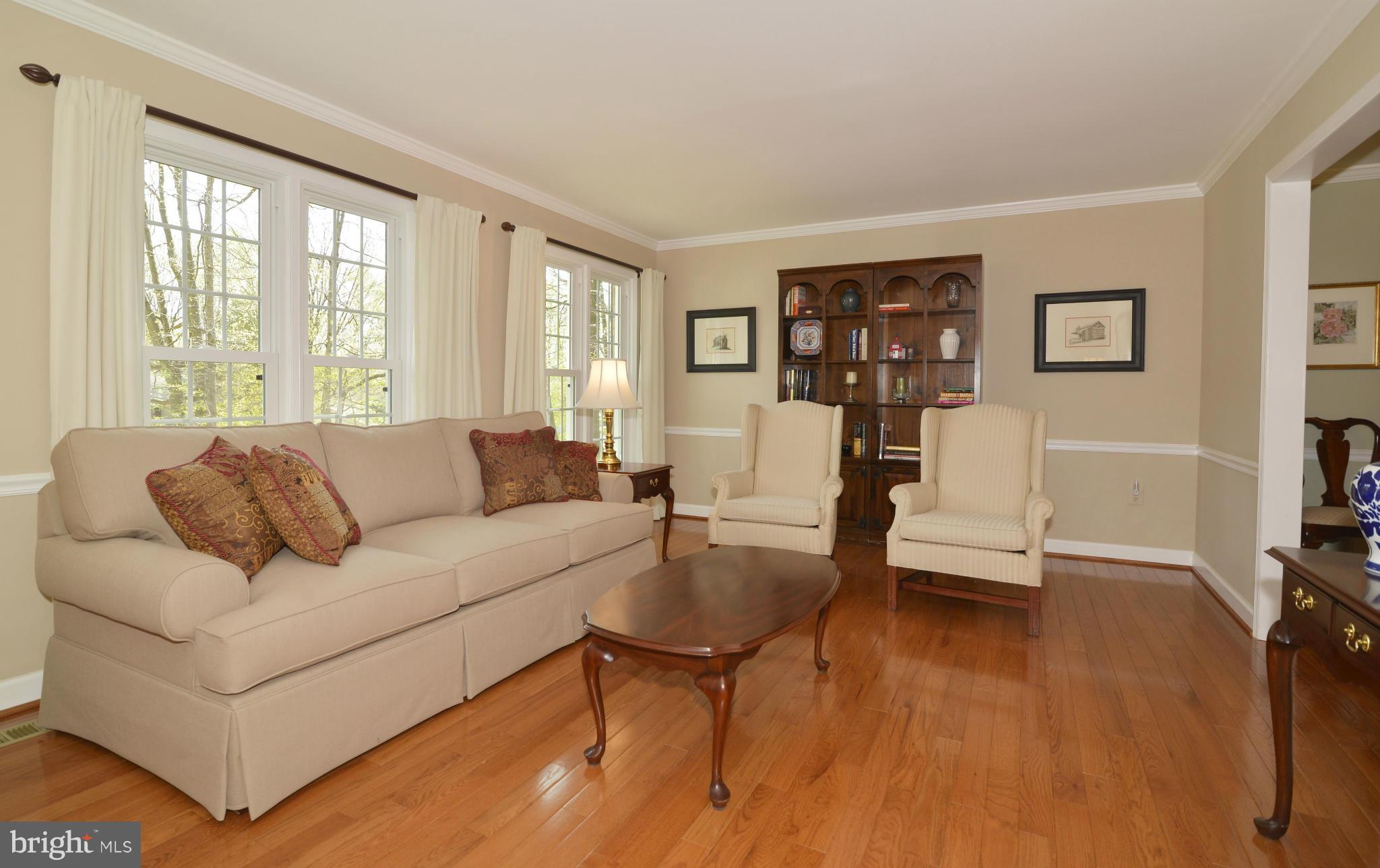 10713 Cross School Road Reston, VA 20191 - Photo 7 of 30 Living Room with hardwood floors and mouldings.