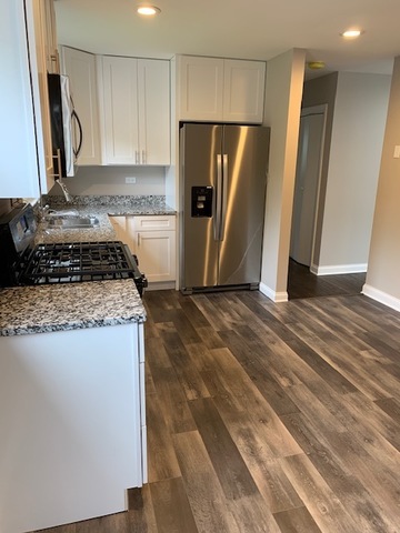 535 Willow Road Wauconda, IL 60084 - Photo 2 of 17 a kitchen with stainless steel appliances granite countertop a refrigerator and a stove
