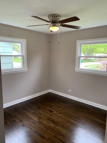 535 Willow Road Wauconda, IL 60084 - Photo 11 of 17 a view of a small space with wooden floor a ceiling fan and a window