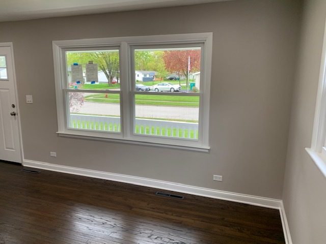 535 Willow Road Wauconda, IL 60084 - Photo 6 of 17 a view of an empty room with wooden floor and a window