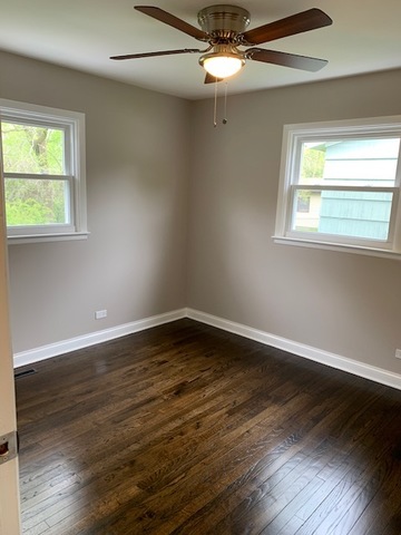 535 Willow Road Wauconda, IL 60084 - Photo 10 of 17 a view of an empty room with wooden floor and a window