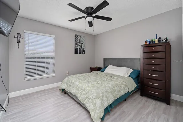 a bedroom with a bed and a dresser