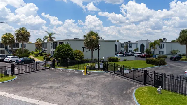 a view of a garden with furniture