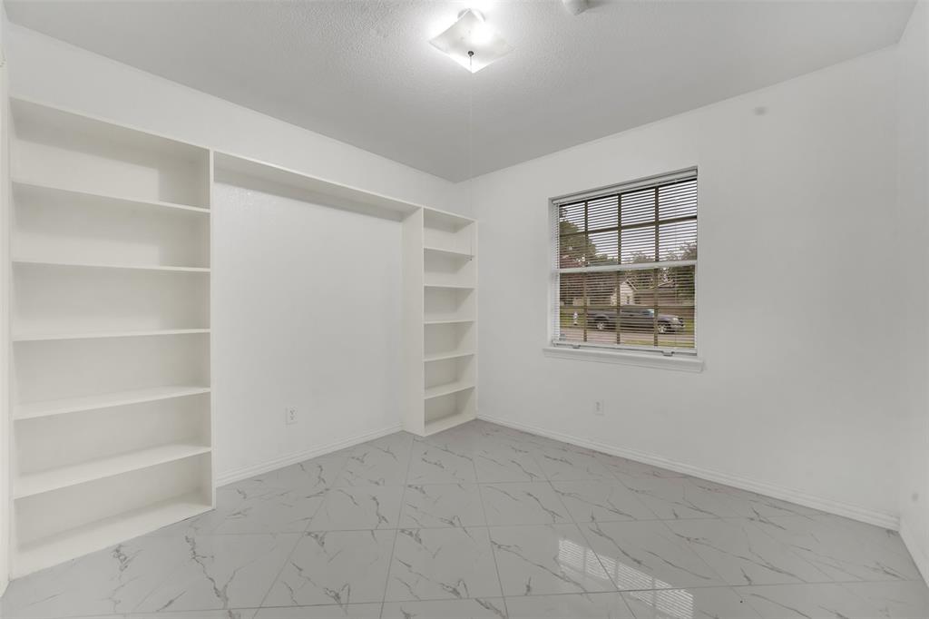 4610 Bucknell Drive Garland, TX 75042 - Photo 12 of 25 a view of an empty room with a window