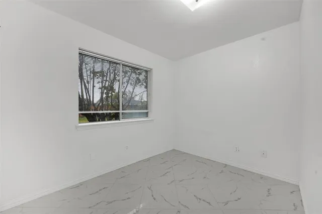 a view of a room with large windows