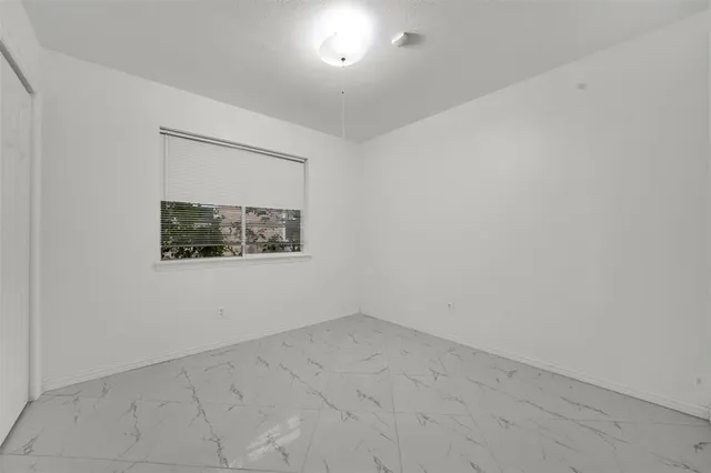 a view of a room with large windows