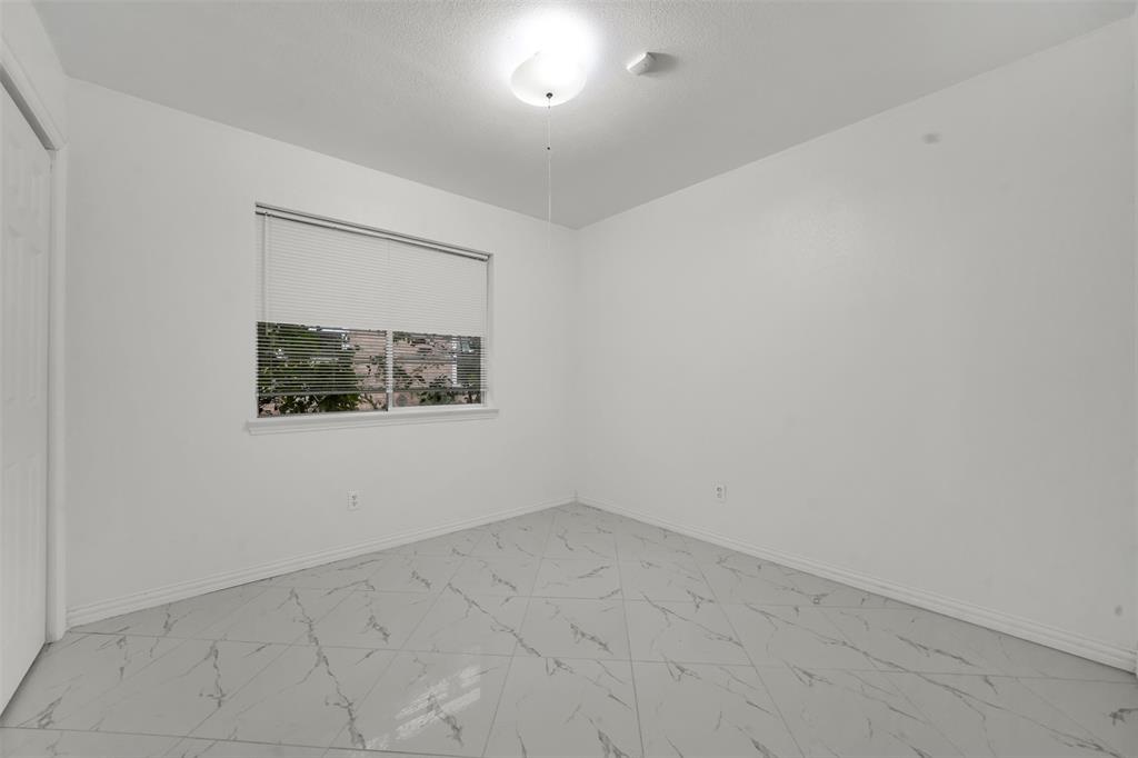 4610 Bucknell Drive Garland, TX 75042 - Photo 18 of 25 an empty room with a window