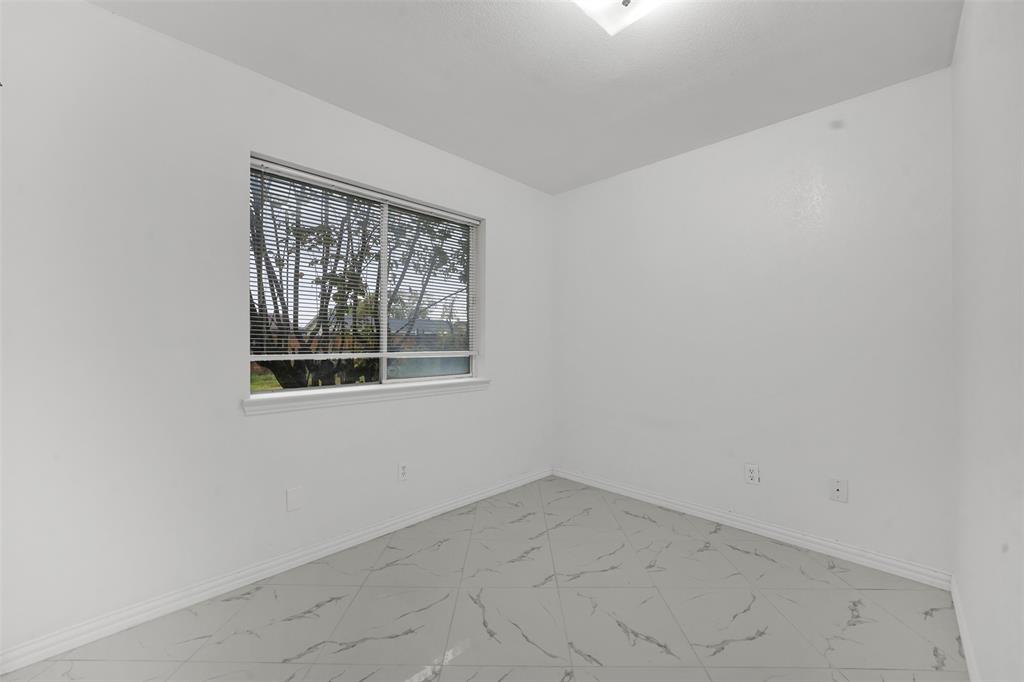 4610 Bucknell Drive Garland, TX 75042 - Photo 20 of 25 an empty room with a window