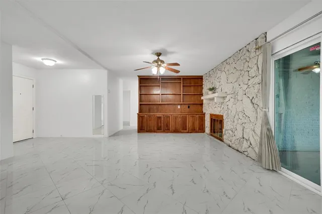 a kitchen with stainless steel appliances granite countertop a sink and cabinets