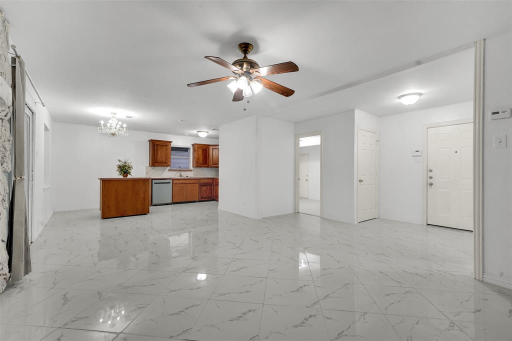 4610 Bucknell Drive Garland, TX 75042 - Photo 5 of 25 a living room with furniture and a ceiling fan