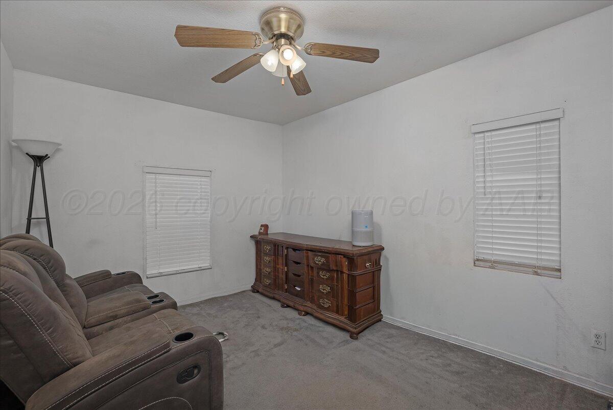 4011 Parker Street Amarillo, TX 79110 - Photo 13 of 17 a living room with furniture and a window