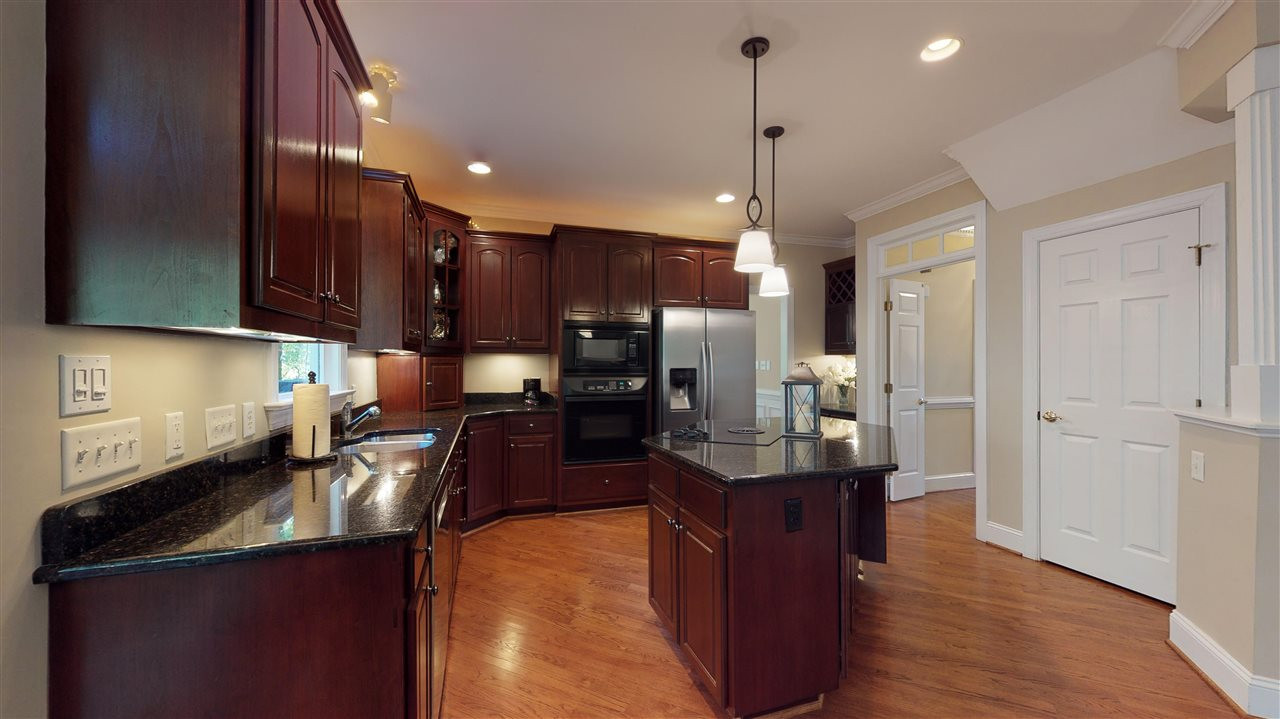3132 Cranesbill Drive Raleigh, NC 27613 - Photo 16 of 30 You'll enjoy the center island cooktop with lots of space surrounding it! Handsome cabinetry, granite countertops and stainless steel appliances all add to the appeal of the kitchen. Kitchen