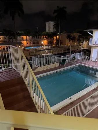 a view of backyard with a table and chairs