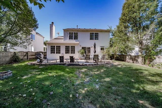 a view of a house with a backyard porch and sitting area