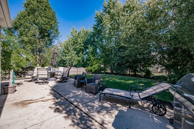 a view of backyard with sitting area
