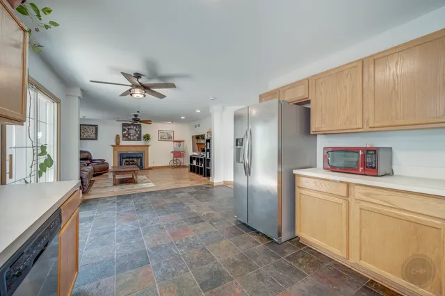 a kitchen with stainless steel appliances a refrigerator sink and cabinets