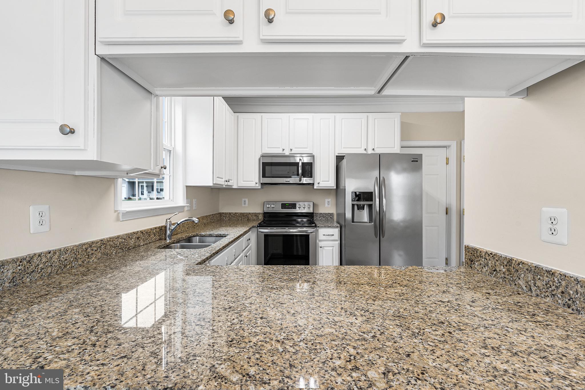 31 Dunmore Drive Hanover, PA 17331 - Photo 14 of 55 a kitchen with granite countertop a refrigerator sink and stove