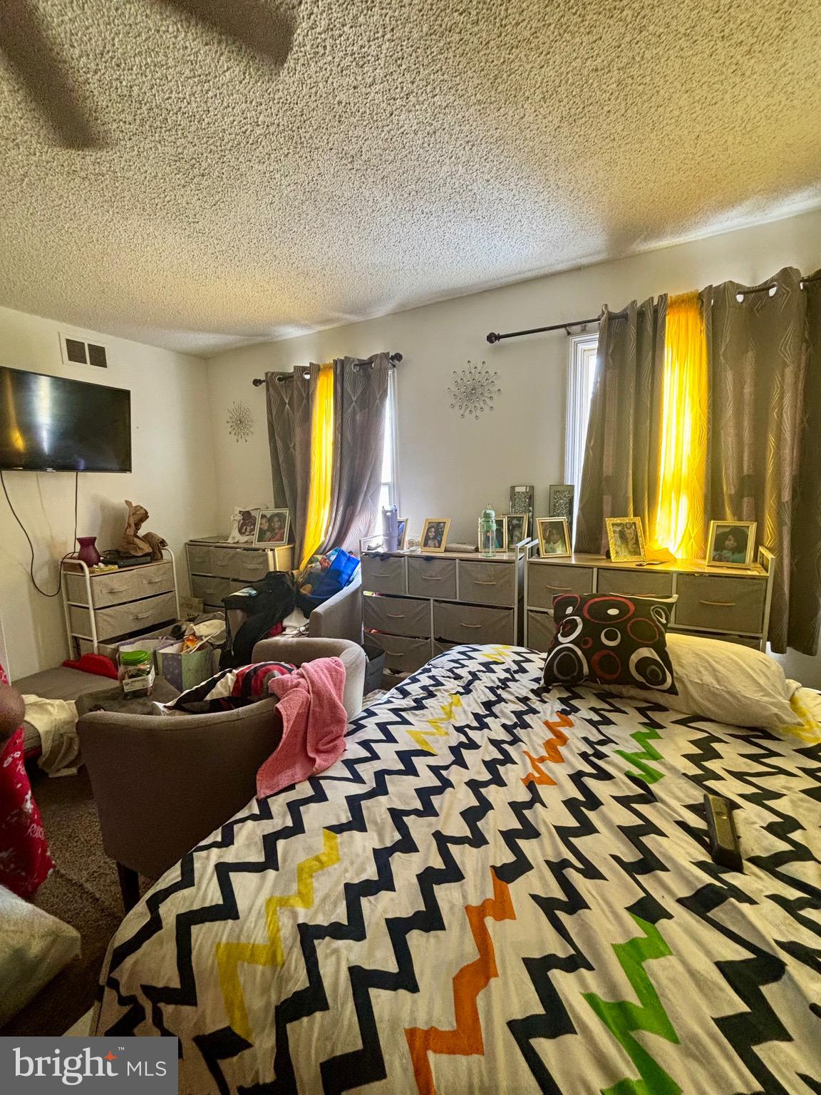 7 Mabel Street Trenton, NJ 08638 - Photo 6 of 20 a living room with furniture and a flat screen tv