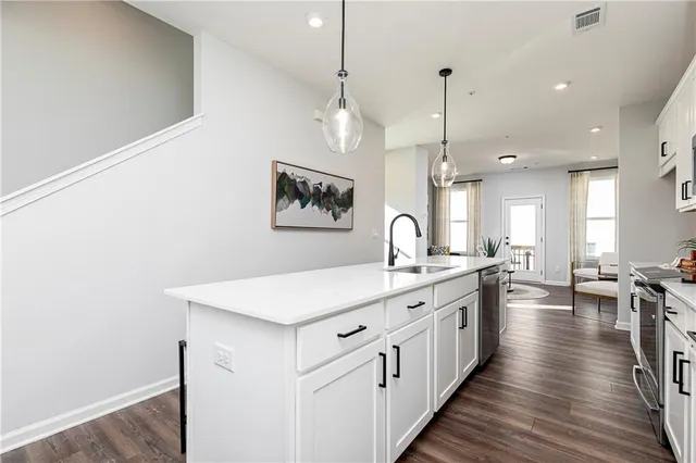 a large white kitchen with lots of counter space