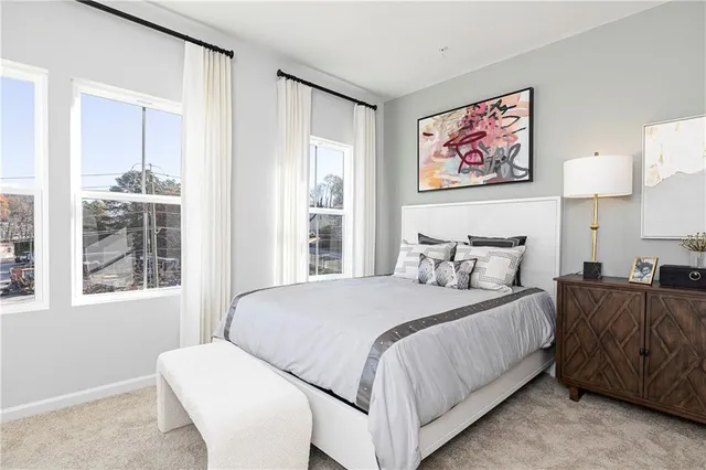 a bedroom with bed and a window