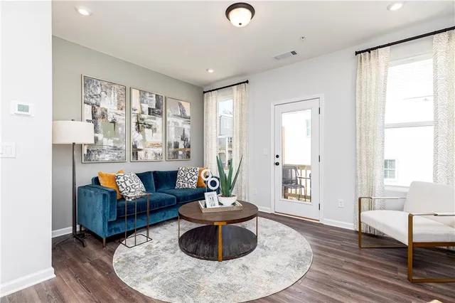 a living room with furniture and a large window