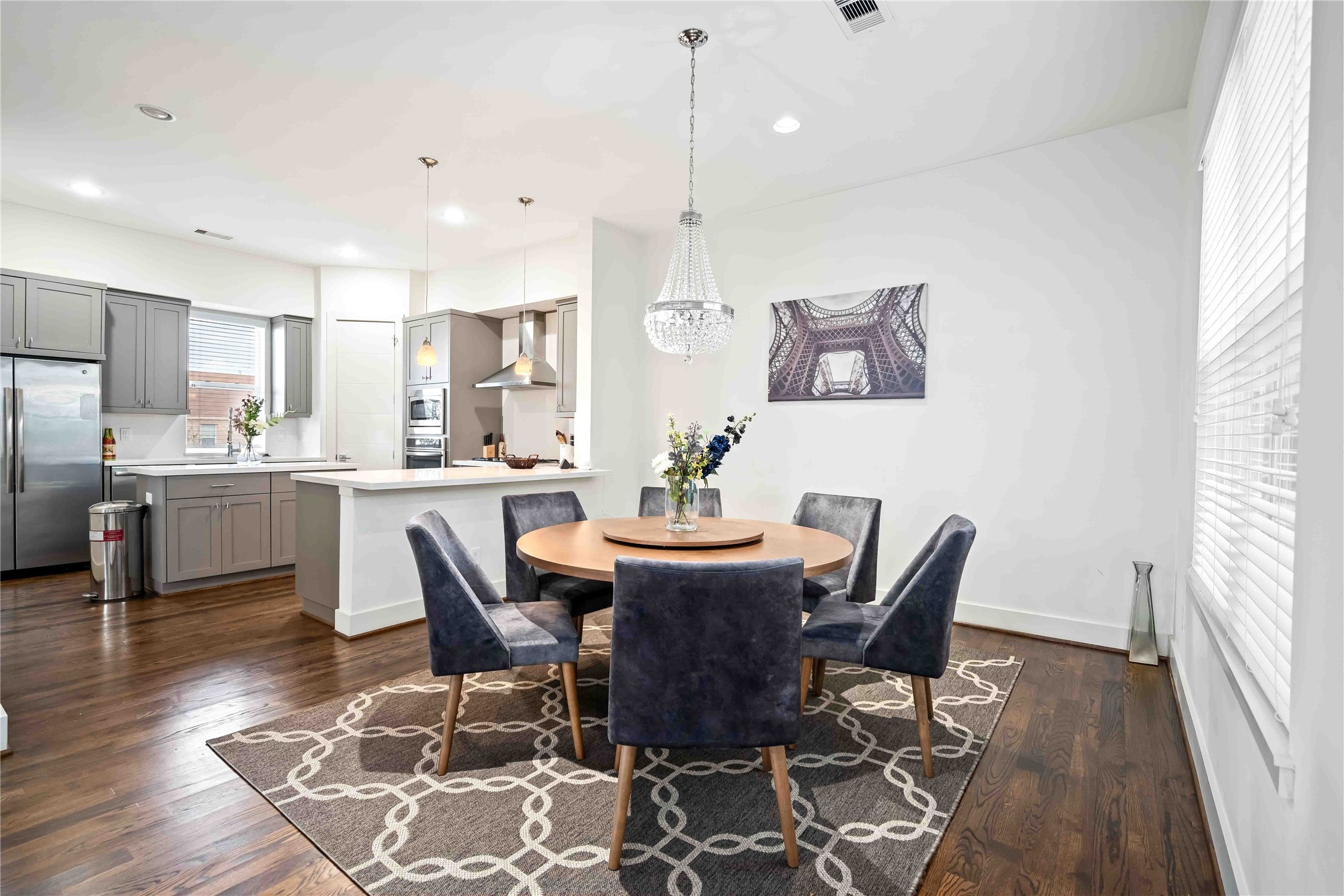 2004 Rosedale Street, Unit F Houston, TX 77004 - Photo 11 of 33 a view of a dining room with furniture and wooden floor
