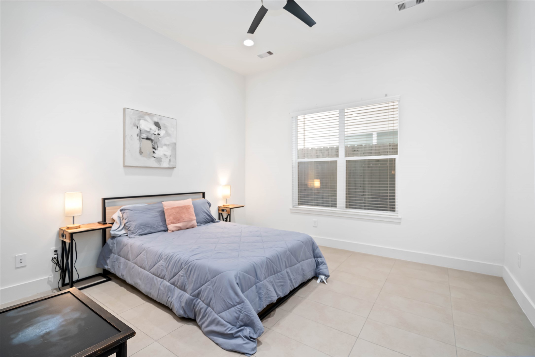 2004 Rosedale Street, Unit F Houston, TX 77004 - Photo 17 of 33 a bedroom with a bed and a window