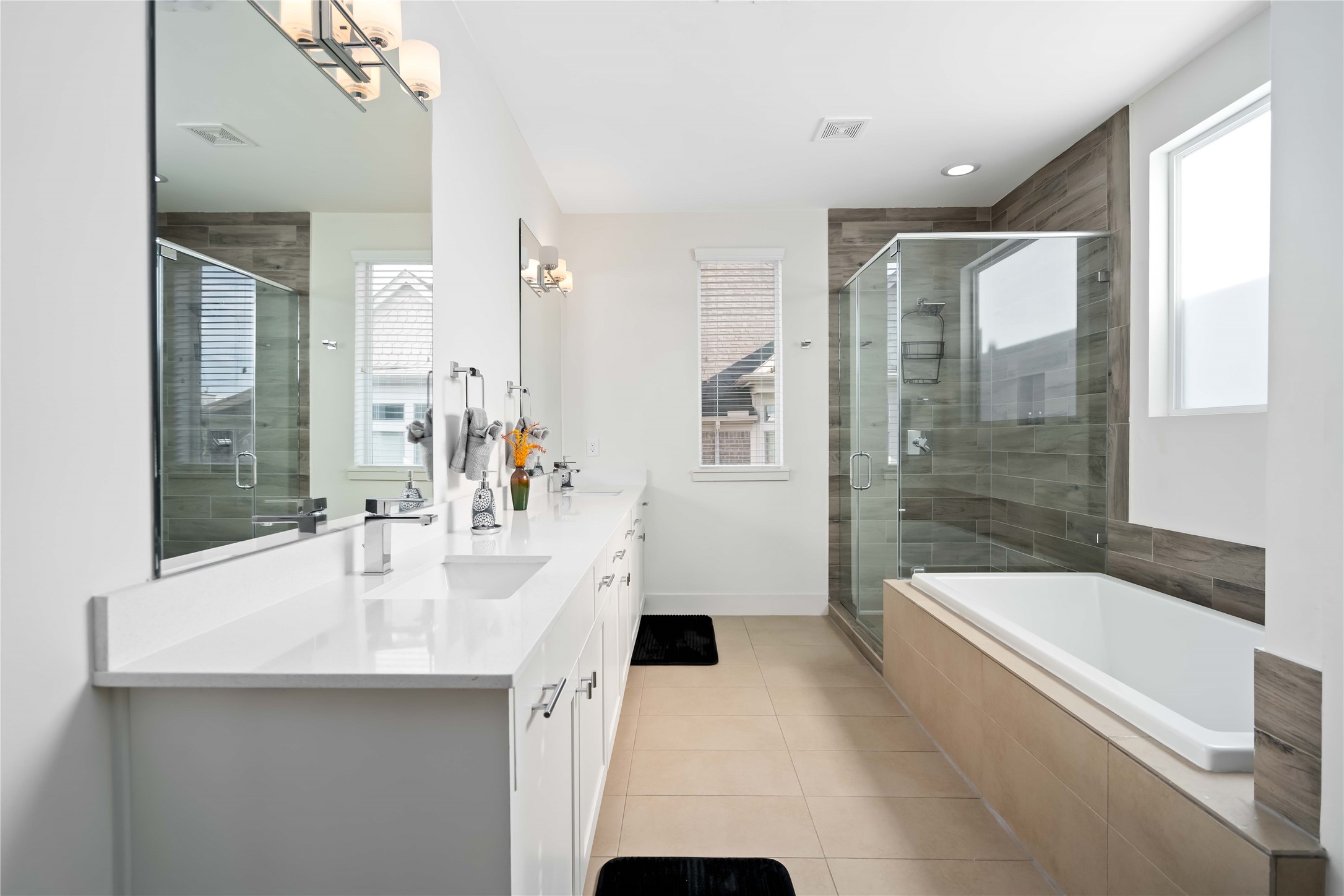 2004 Rosedale Street, Unit F Houston, TX 77004 - Photo 22 of 33 a bathroom with a tub a sink and mirror
