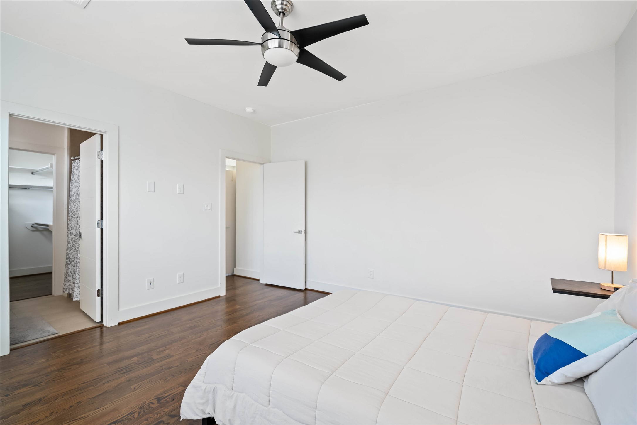 2004 Rosedale Street, Unit F Houston, TX 77004 - Photo 27 of 33 a bedroom with a bed and a view of kitchen