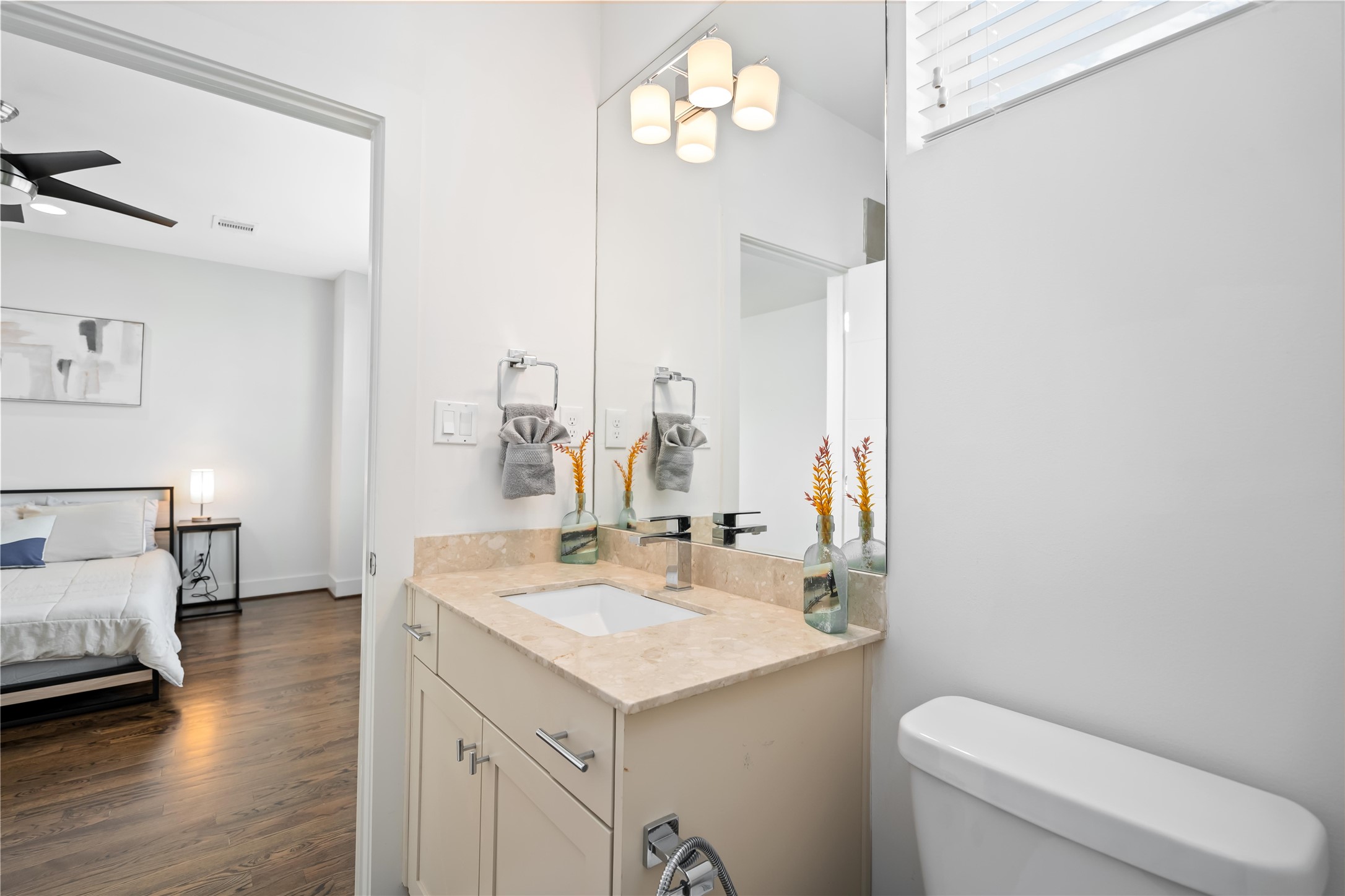 2004 Rosedale Street, Unit F Houston, TX 77004 - Photo 30 of 33 a bathroom with a sink a toilet and a mirror