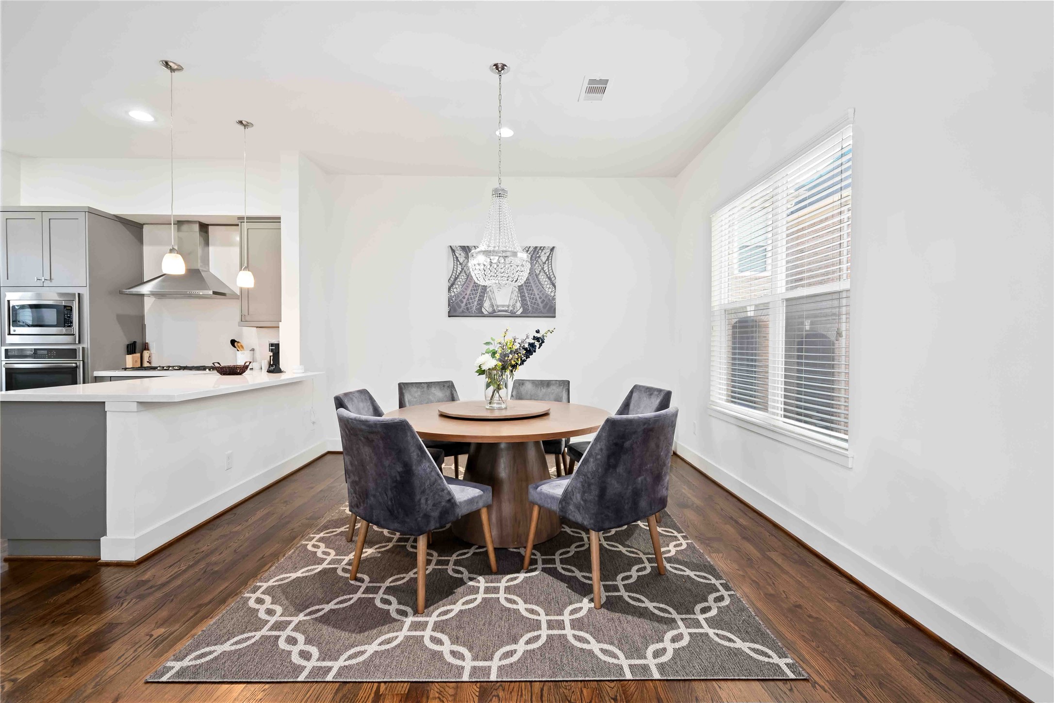 2004 Rosedale Street, Unit F Houston, TX 77004 - Photo 9 of 33 a dining room with furniture a rug and wooden floor