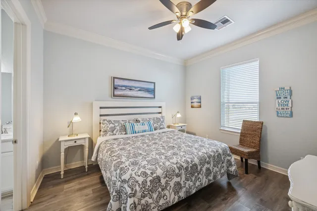 a bedroom with a bed and a chair