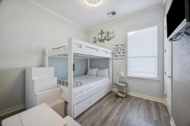 a bed room with a bed and a window