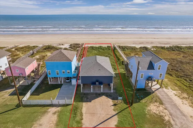 a aerial view of a house with a ocean view