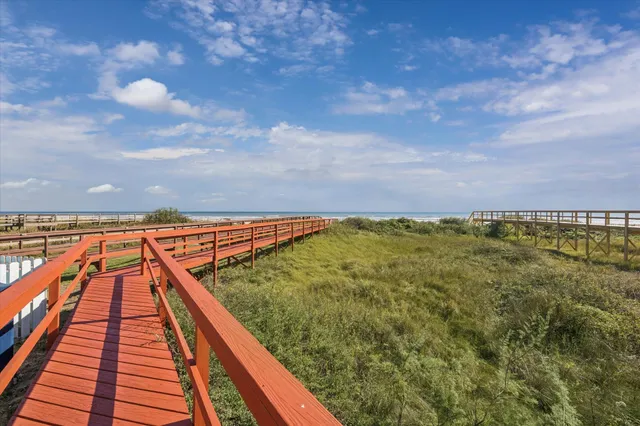 a view of swimming pool with a yard