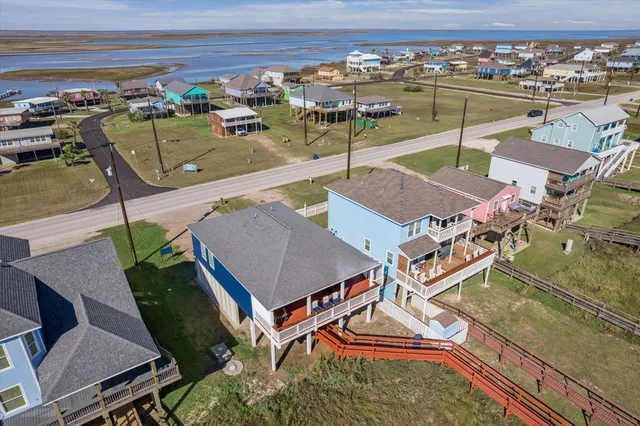 an aerial view of a house with a ocean view