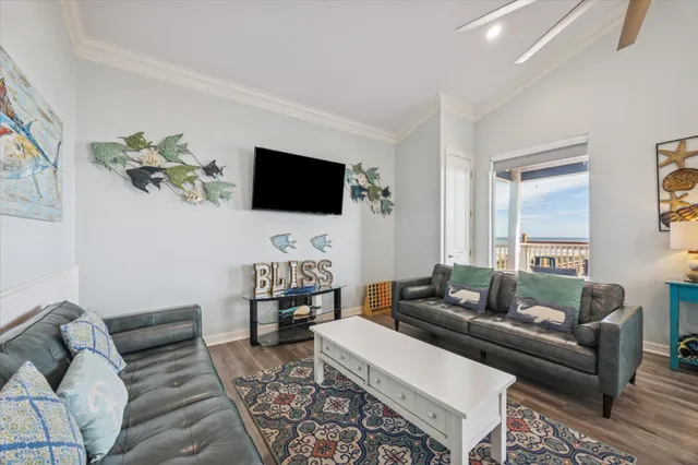 a living room with furniture and a flat screen tv
