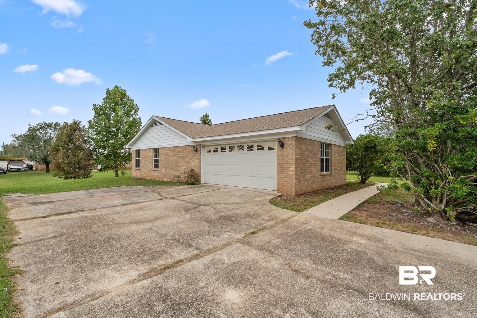 16418 Avent Lane Foley, AL 36535 - Photo 4 of 30 View of front of house with a front lawn and a garage