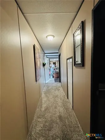 a bathroom with a granite countertop sink and a toilet